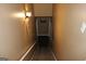 A clean and well lit carpeted stairway down to the basement of the house at 9342 Carillon Ct, Jonesboro, GA 30236
