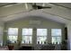 Sunroom with vaulted ceilings and plenty of natural light from the many windows at 9342 Carillon Ct, Jonesboro, GA 30236