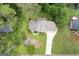 Birds eye view of the home featuring the roof, driveway and the surrounding landscaping at 423 Mephisto Cir, Lawrenceville, GA 30046