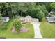Expansive aerial view of the home showcasing lush landscaping and long driveway at 423 Mephisto Cir, Lawrenceville, GA 30046