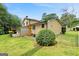 Back of home featuring a lattice-covered porch and mature landscaping at 423 Mephisto Cir, Lawrenceville, GA 30046