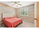 Bedroom featuring carpet floors, light-colored wood paneling, and a window at 423 Mephisto Cir, Lawrenceville, GA 30046