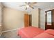 Bedroom with carpet floors, light-colored walls, and a ceiling fan at 423 Mephisto Cir, Lawrenceville, GA 30046