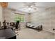 Bedroom with a single bed, desk, and a window with natural light at 423 Mephisto Cir, Lawrenceville, GA 30046