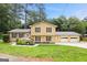 Charming two-story home with a welcoming front porch and manicured landscaping at 423 Mephisto Cir, Lawrenceville, GA 30046