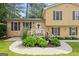 Charming front entrance with a well-manicured garden and a inviting front porch at 423 Mephisto Cir, Lawrenceville, GA 30046