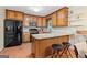 Charming kitchen with wooden cabinets, stainless steel appliances, and a breakfast bar at 423 Mephisto Cir, Lawrenceville, GA 30046