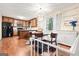The bright kitchen features wood cabinets, an island, and is adjacent to the dining area at 423 Mephisto Cir, Lawrenceville, GA 30046