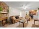 Inviting living room featuring a stone fireplace, warm lighting, and comfortable seating at 423 Mephisto Cir, Lawrenceville, GA 30046
