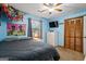 Cozy bedroom featuring a plush bed, ample natural light, and quirky decorations, creating a comfortable and inviting atmosphere at 69 Trace Ct, Stockbridge, GA 30281