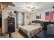 Comfortable bedroom featuring a cozy bed, ceiling fan, and natural light, perfect for relaxation and rest at 69 Trace Ct, Stockbridge, GA 30281