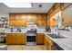 Bright kitchen boasts ample cabinet space, stainless steel appliances, and modern countertop at 69 Trace Ct, Stockbridge, GA 30281