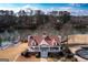 Aerial view of community clubhouse, featuring lake views, and well-manicured lawns and landscaping at 155 Glenwood Ln, Fayetteville, GA 30215