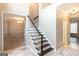 Grand foyer features marble floors, a staircase with dark wood treads, and an open floor plan at 155 Glenwood Ln, Fayetteville, GA 30215
