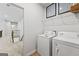 Bright laundry area with white appliances and decor at 817 Dobby Way # 96, Mcdonough, GA 30252
