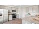 Modern kitchen with granite countertops, stainless steel appliances, and gray cabinets at 5449 Baybrook Cir, South Fulton, GA 30349