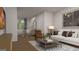 Bright living room with hardwood floors, white sofa, modern decor, and open concept dining at 5449 Baybrook Cir, South Fulton, GA 30349