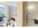 Bathroom features a shower and tub, and a view into the main bedroom at 115 Glen Echo Dr., Covington, GA 30016
