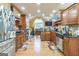 Well-equipped kitchen with stainless steel appliances, dark countertops, and ample wood cabinetry at 115 Glen Echo Dr., Covington, GA 30016