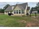 Well maintained backyard featuring a fence, a patio area, a grill, and a home exterior at 521 Deadwood Trl, Locust Grove, GA 30248