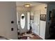 Inviting entryway featuring a decorative rug, neutral walls, art and access to other rooms at 521 Deadwood Trl, Locust Grove, GA 30248