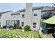 A backyard featuring a patio with outdoor seating and well-maintained landscaping around the perimeter at 12402 Muir Field Ct, Fayetteville, GA 30215