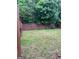 Fenced backyard featuring a grass lawn and mature trees, offering a private outdoor space at 11755 Lovejoy Crossing Blvd, Hampton, GA 30228