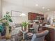 Well-lit dining area with clear glass table adjacent to an open kitchen at 11755 Lovejoy Crossing Blvd, Hampton, GA 30228