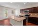 Modern kitchen featuring stainless steel appliances and a granite countertop island at 11755 Lovejoy Crossing Blvd, Hampton, GA 30228
