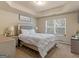 A large main bedroom features a tray ceiling, natural light, and neutral decor at 11755 Lovejoy Crossing Blvd, Hampton, GA 30228