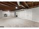 Spacious basement featuring carpet flooring, an open ceiling and a walkout at 1504 Oglethorpe Dr, Suwanee, GA 30024