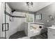 Bathroom showcasing a glass shower, soaking tub, and window with natural light at 1504 Oglethorpe Dr, Suwanee, GA 30024