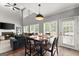 Dining area with vaulted ceilings, backyard access, and a view to the living area at 1504 Oglethorpe Dr, Suwanee, GA 30024