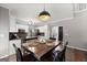 Dining area next to kitchen with backyard access and view to kitchen appliances at 1504 Oglethorpe Dr, Suwanee, GA 30024