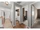 Open hallway leading to a bedroom and bathroom in the home at 1504 Oglethorpe Dr, Suwanee, GA 30024