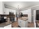Lovely kitchen featuring modern appliances, granite countertops, and center island at 1504 Oglethorpe Dr, Suwanee, GA 30024