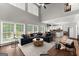 Spacious living room seamlessly connects to an open-concept kitchen and dining area at 1504 Oglethorpe Dr, Suwanee, GA 30024