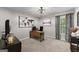 Functional office space featuring a desk, chair, natural light from the window and artwork at 1504 Oglethorpe Dr, Suwanee, GA 30024