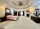 The main bedroom is large and open, and features a fireplace and a seating area at 1442 Swiftwater Cir, Mcdonough, GA 30252