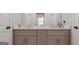 Bathroom with a double vanity, modern fixtures and neutral tones at 5490 Bent Grass Way, Douglasville, GA 30135