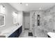 Modern bathroom with double vanity, a glass-enclosed shower, and beautiful marble tile at 5490 Bent Grass Way, Douglasville, GA 30135