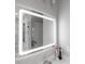Contemporary bathroom mirror reflecting marble shower with upscale fixtures at 5490 Bent Grass Way, Douglasville, GA 30135