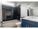 Stylish bathroom featuring black subway tile, a modern vanity, and a shower-tub combination at 5490 Bent Grass Way, Douglasville, GA 30135