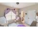 Bright, charming Bedroom with purple accents, natural light and custom wall decorations at 5490 Bent Grass Way, Douglasville, GA 30135