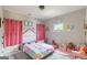 ' bedroom with rainbow bedding, whimsical décor and a cozy, playful atmosphere at 5490 Bent Grass Way, Douglasville, GA 30135