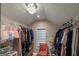 Walk-in closet with custom shelving and chandelier lighting at 5490 Bent Grass Way, Douglasville, GA 30135