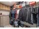 A well-organized walk-in closet featuring shelves and clothing racks is any homeowner's dream at 5490 Bent Grass Way, Douglasville, GA 30135