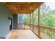 Expansive wooden deck with railing and a picturesque view of trees and greenery, offers a private outdoor space at 5490 Bent Grass Way, Douglasville, GA 30135