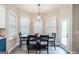 Bright dining area features a modern light fixture and large windows offering natural light at 5490 Bent Grass Way, Douglasville, GA 30135