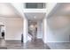 Spacious foyer showcasing wood flooring, staircase, and an open layout for versatile living space at 5490 Bent Grass Way, Douglasville, GA 30135